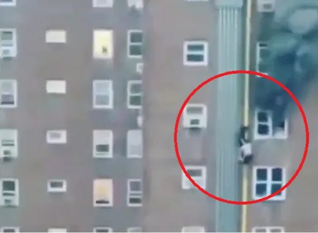 Teenage brothers slide down a pipe to escape a burning apartment ...